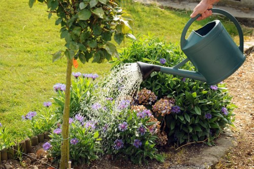 Gardening team performing seasonal maintenance in a communal Fitzrovia garden